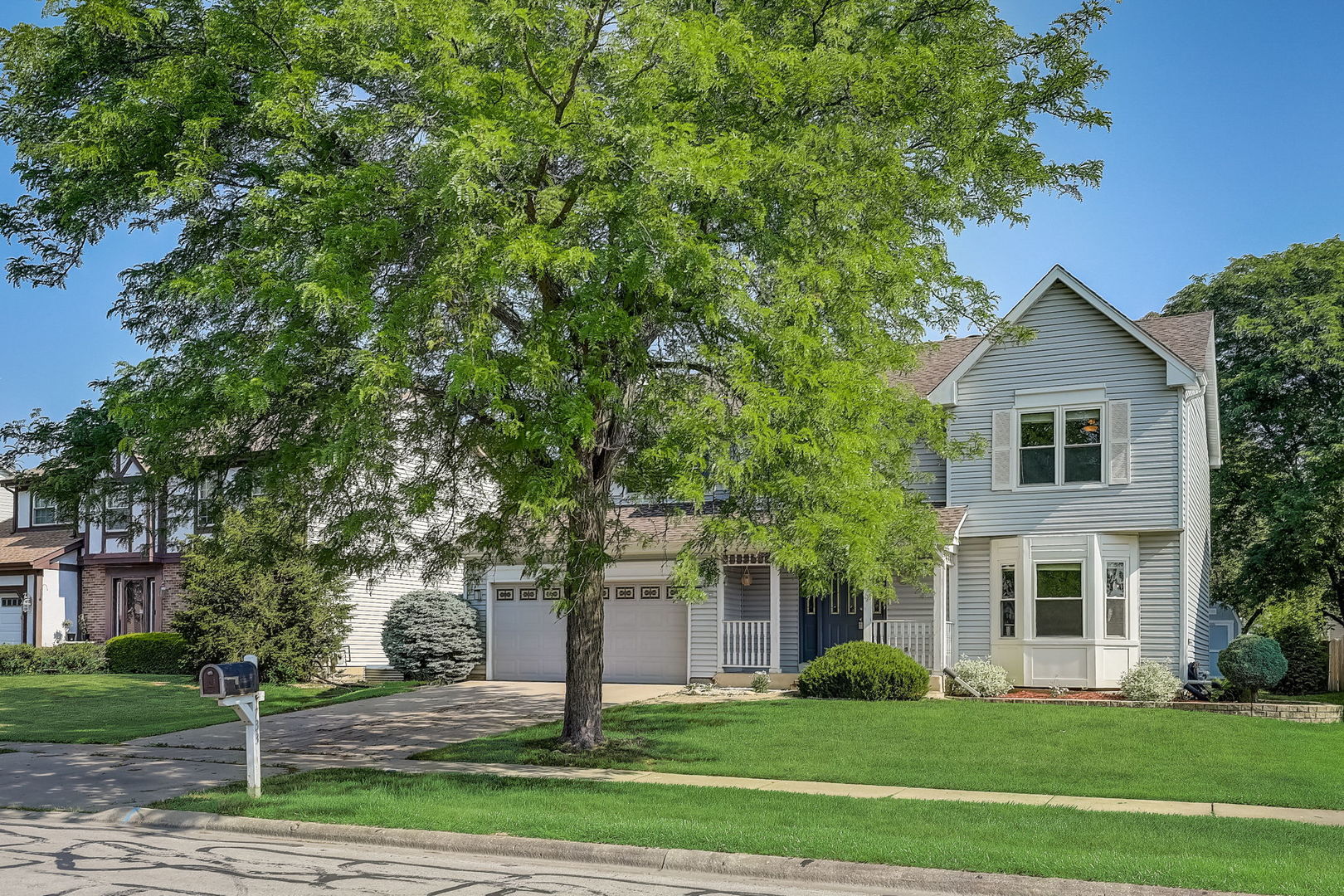 733 Thunderbird Trail Carol Stream, IL 60188 - Photo 27 of 31 a front view of a house with a yard