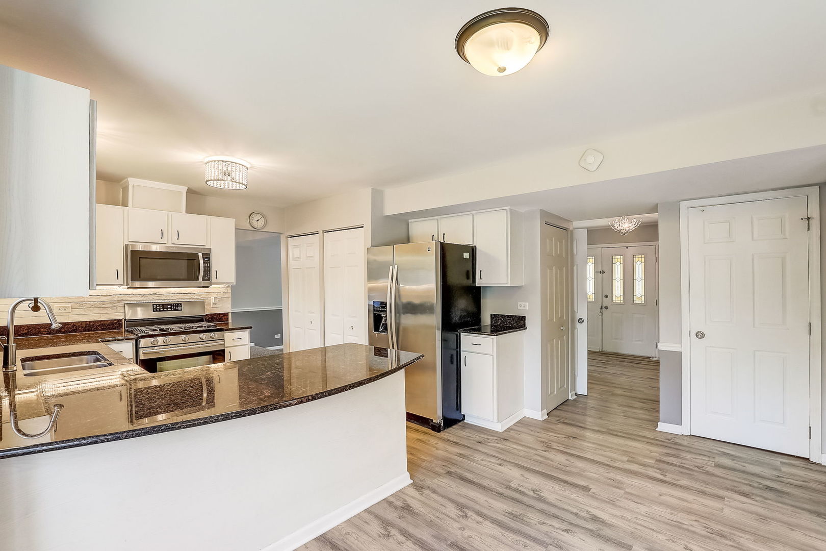 733 Thunderbird Trail Carol Stream, IL 60188 - Photo 7 of 31 a kitchen with stainless steel appliances granite countertop a refrigerator stove and oven
