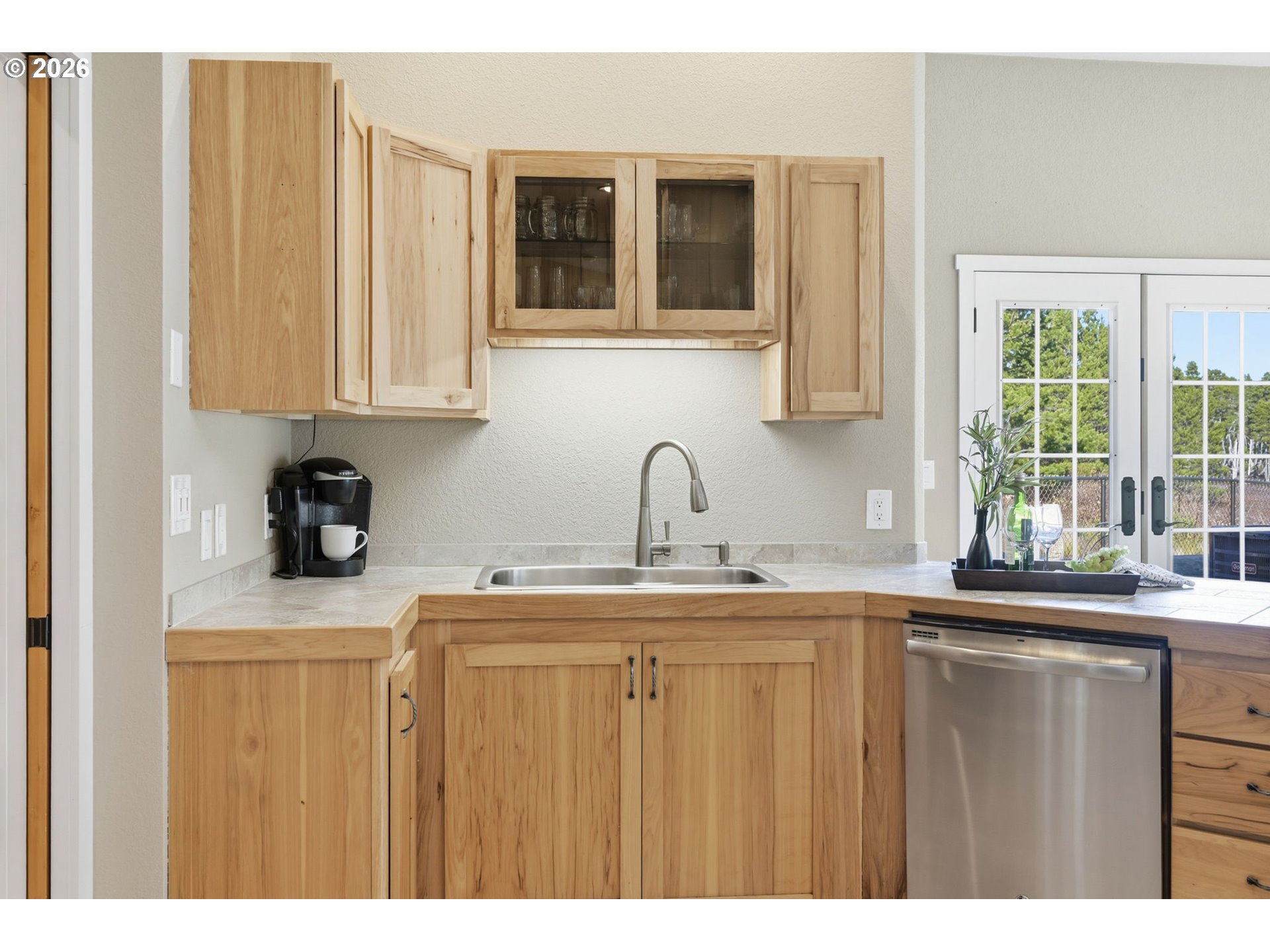 5200 Dunewood Drive Florence, OR 97439 - Photo 11 of 48 a kitchen with stainless steel appliances granite countertop a sink a window and a granite counter tops