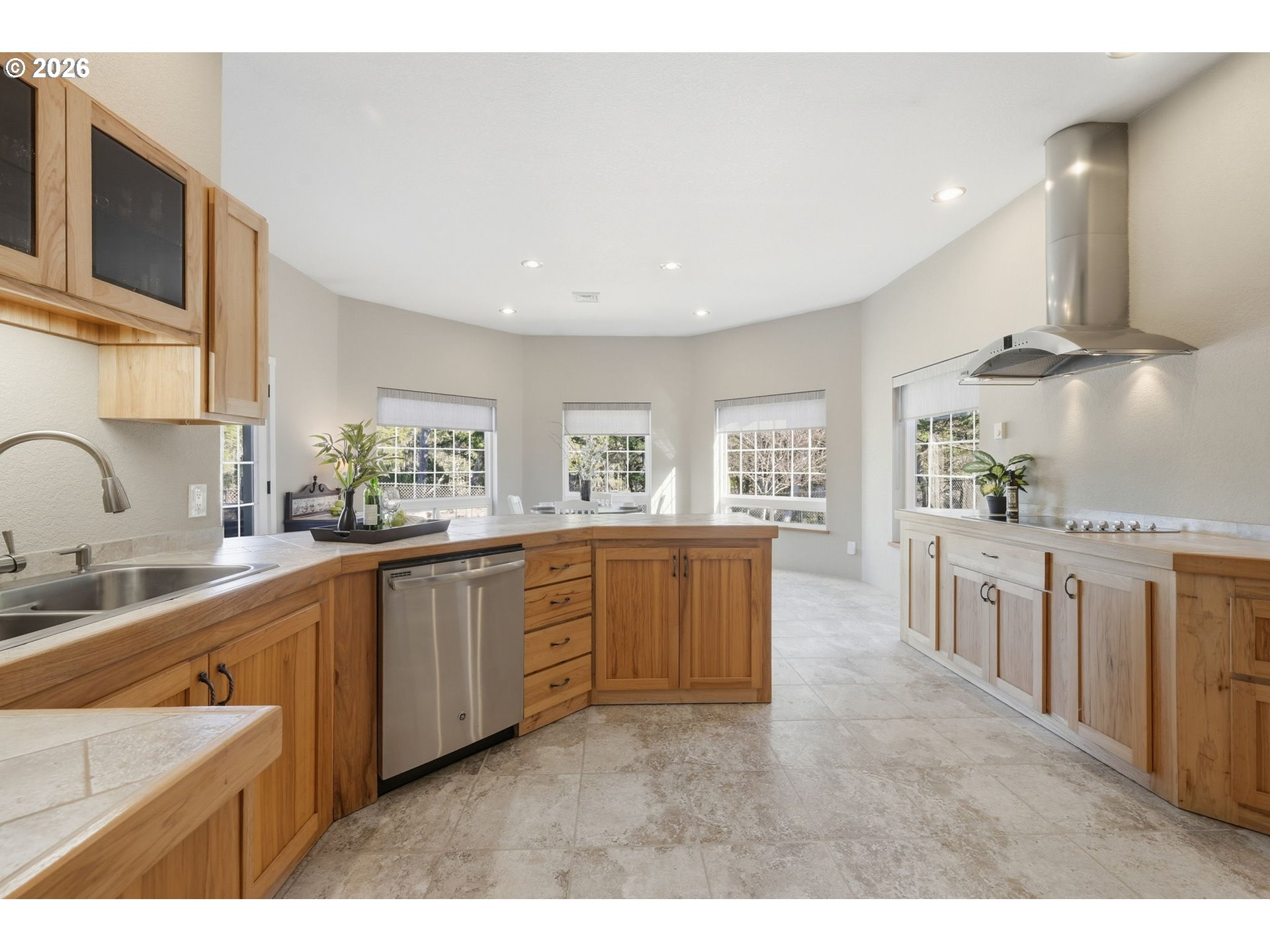 5200 Dunewood Drive Florence, OR 97439 - Photo 12 of 48 a kitchen with stainless steel appliances kitchen island granite countertop a sink a stove top oven a counter space and cabinets