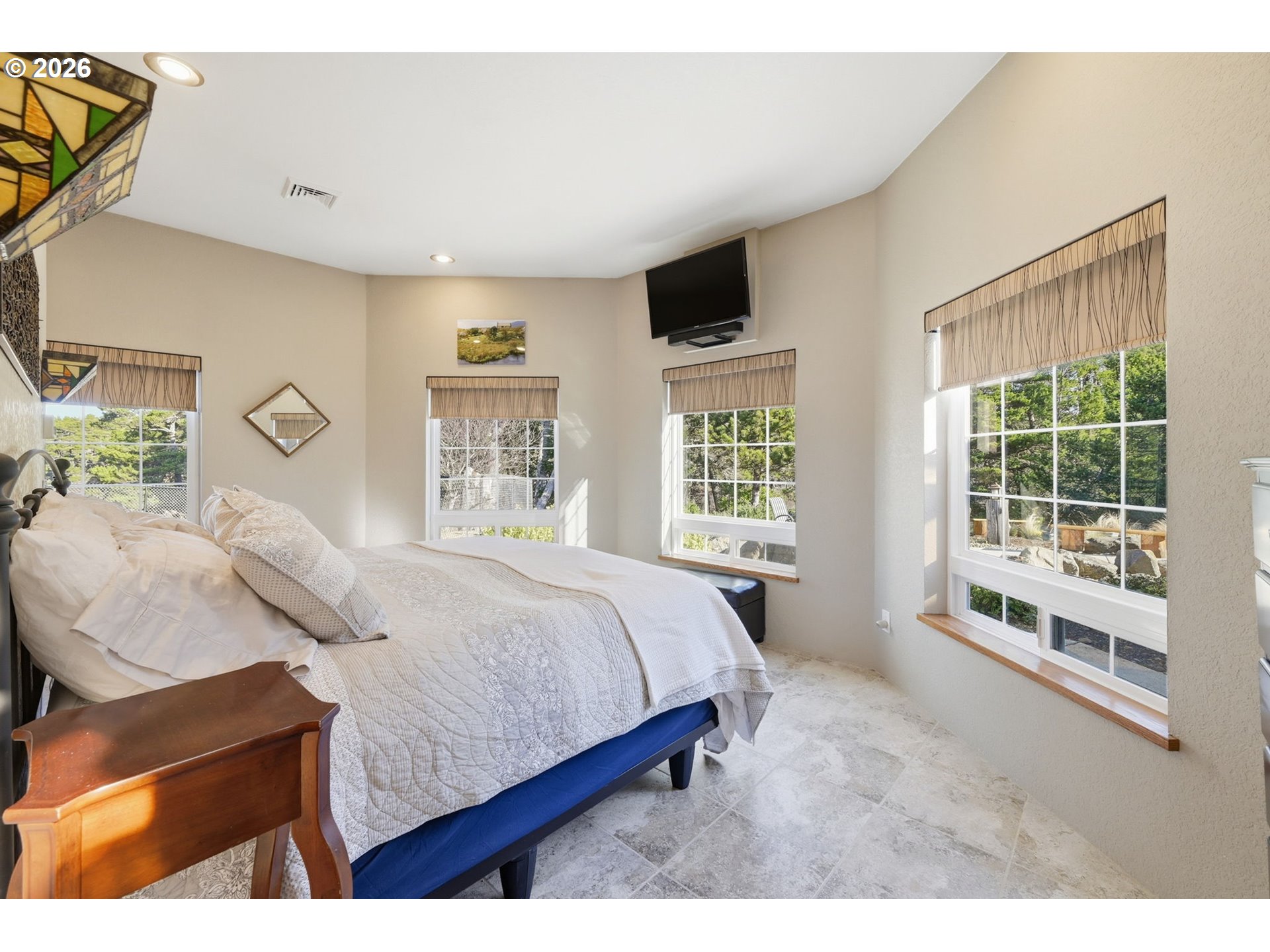 5200 Dunewood Drive Florence, OR 97439 - Photo 18 of 48 a bedroom with a large bed and a window