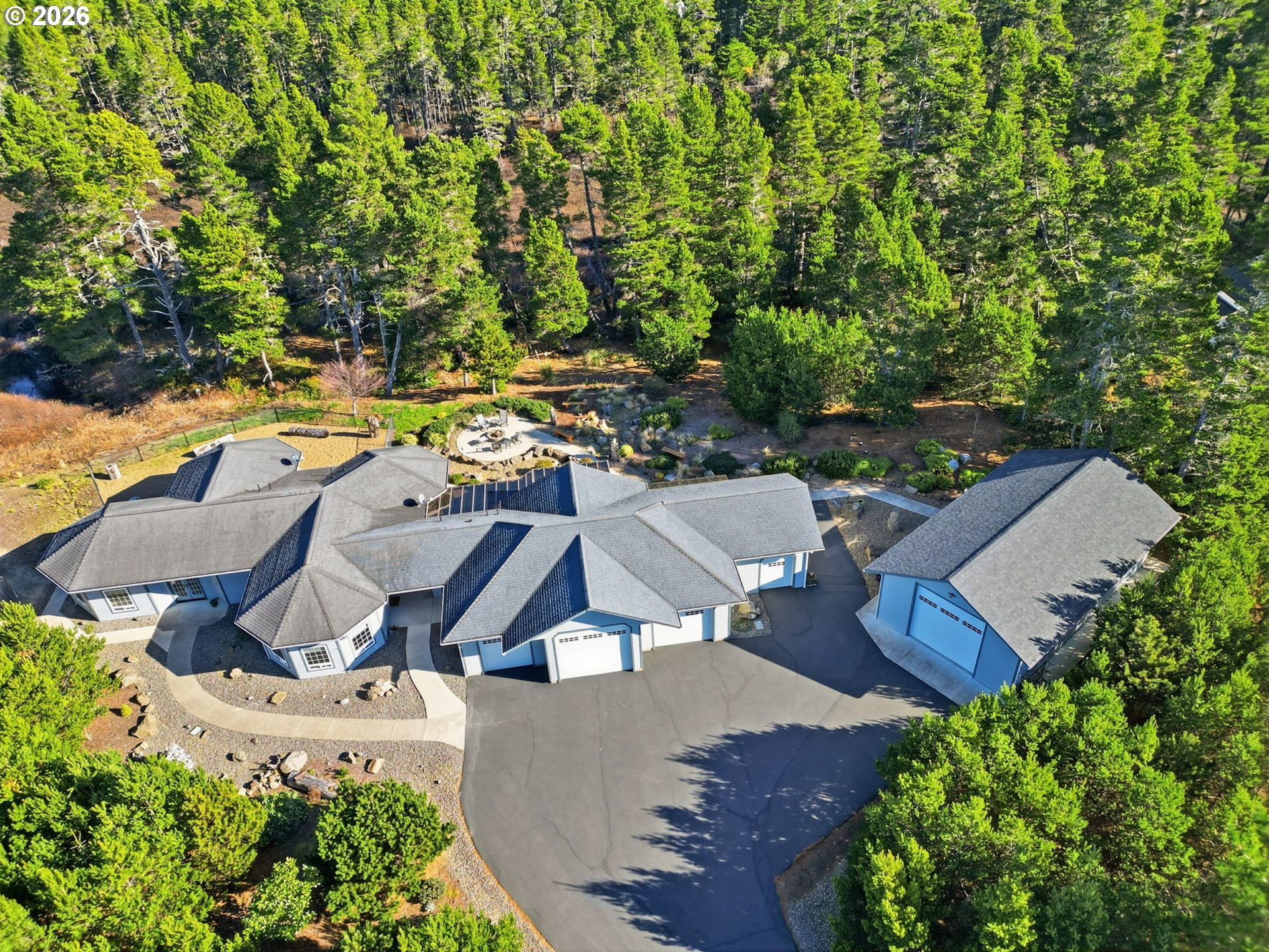 5200 Dunewood Drive Florence, OR 97439 - Photo 2 of 48 an aerial view of residential house with outdoor space and swimming pool