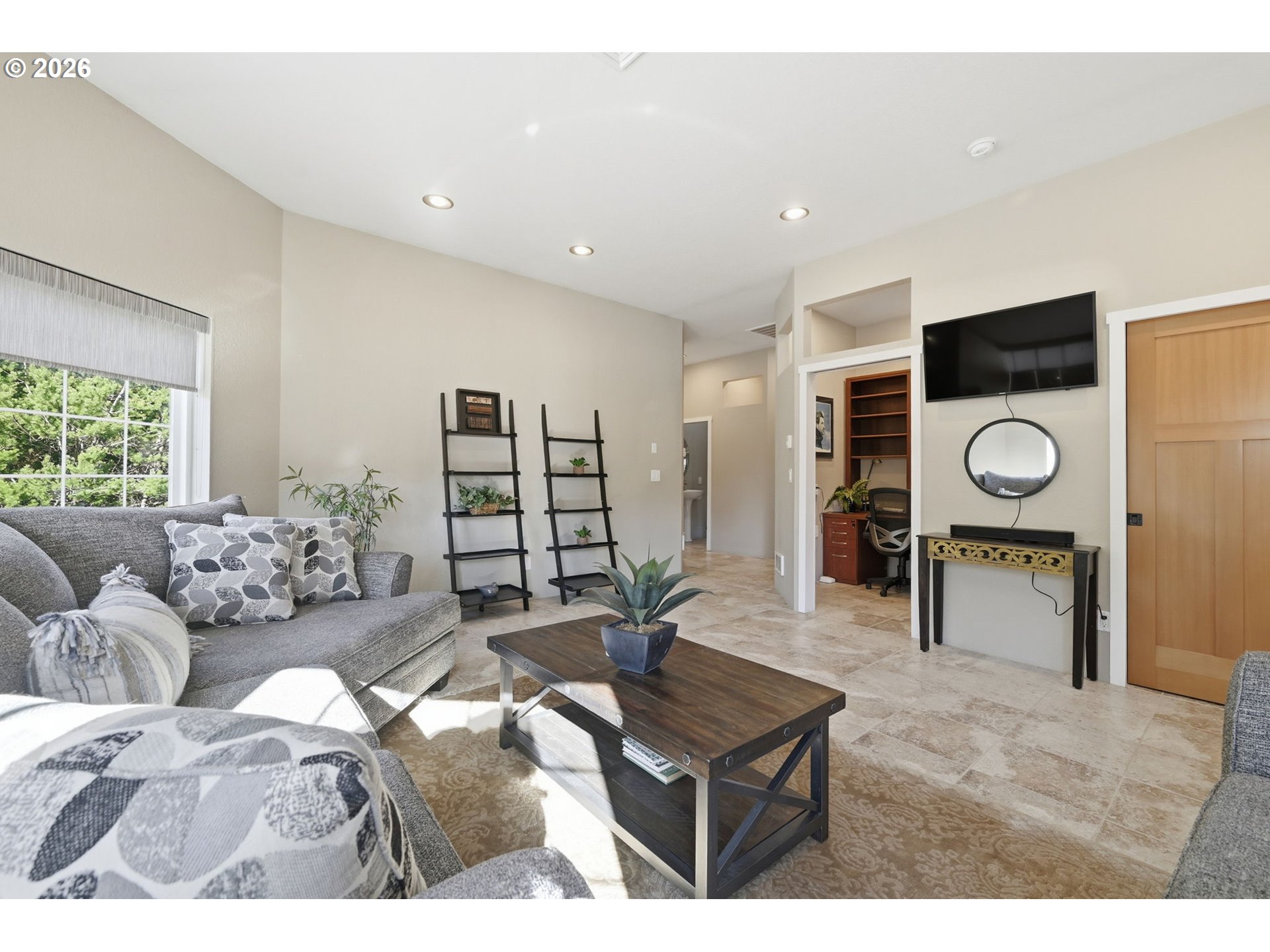 5200 Dunewood Drive Florence, OR 97439 - Photo 25 of 48 a living room with furniture and a clock