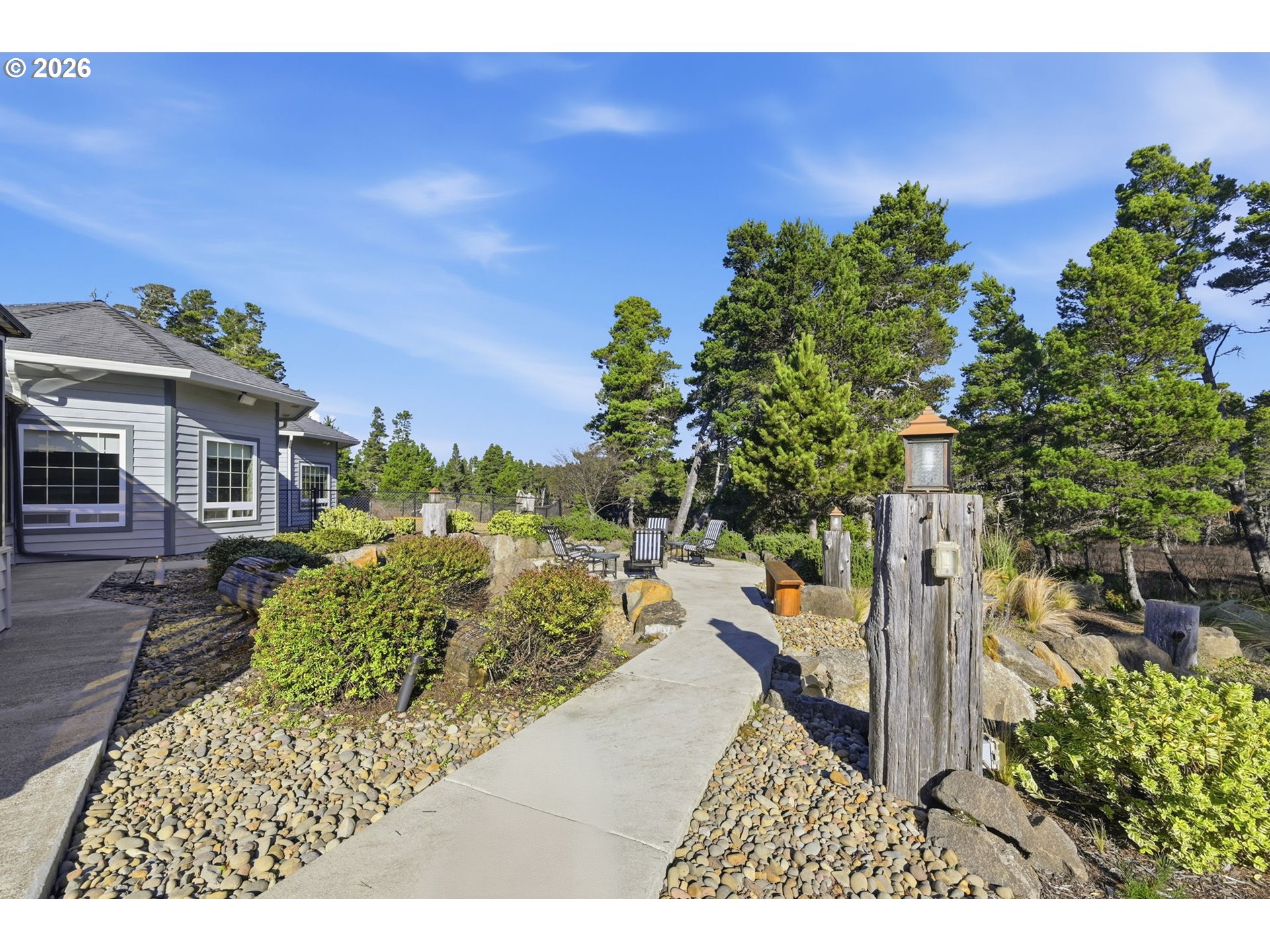 5200 Dunewood Drive Florence, OR 97439 - Photo 40 of 48 a view of a house with a yard