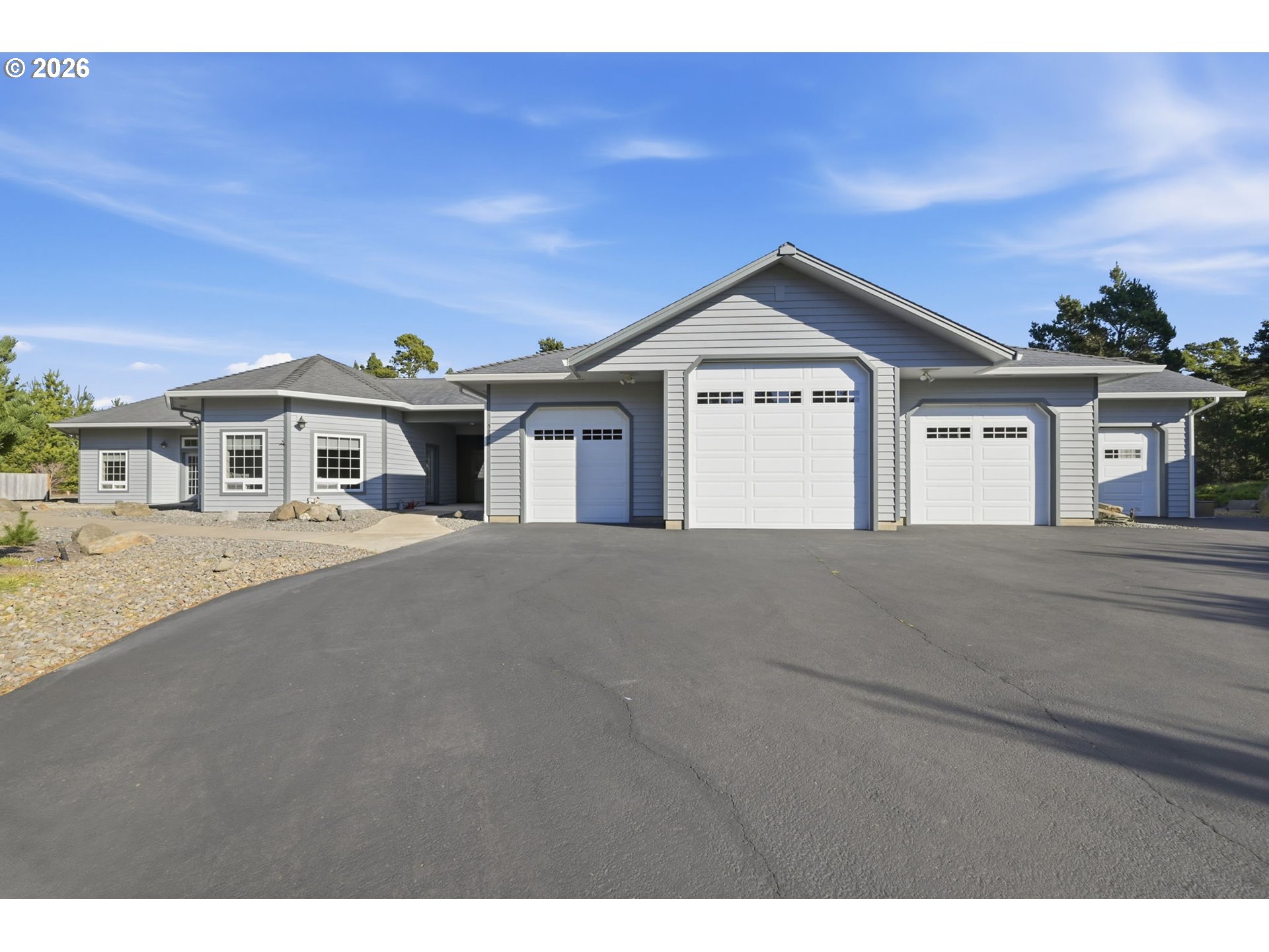 5200 Dunewood Drive Florence, OR 97439 - Photo 5 of 48 a view of a house with a yard and potted plants