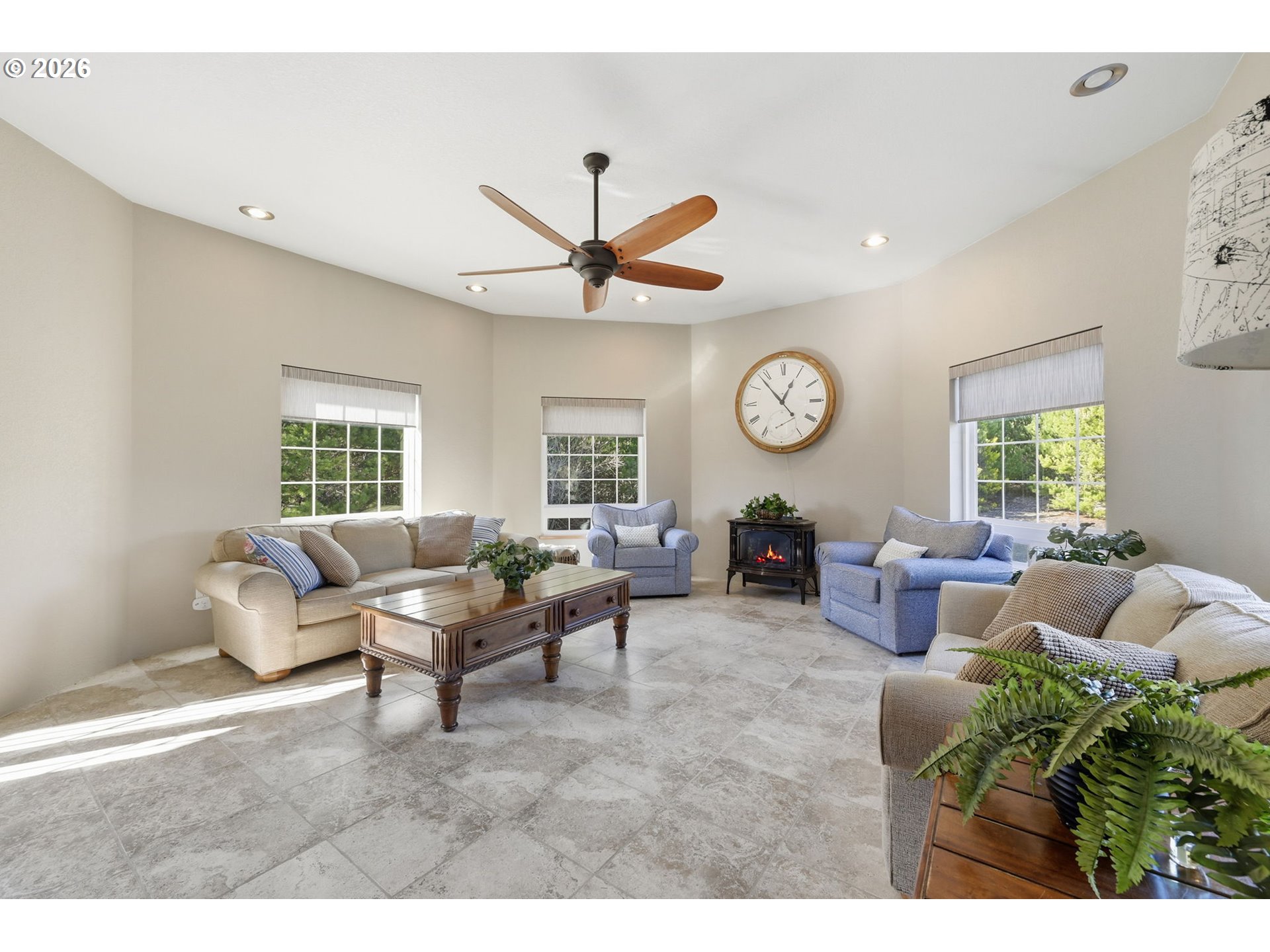 5200 Dunewood Drive Florence, OR 97439 - Photo 8 of 48 a living room with furniture a clock and a window