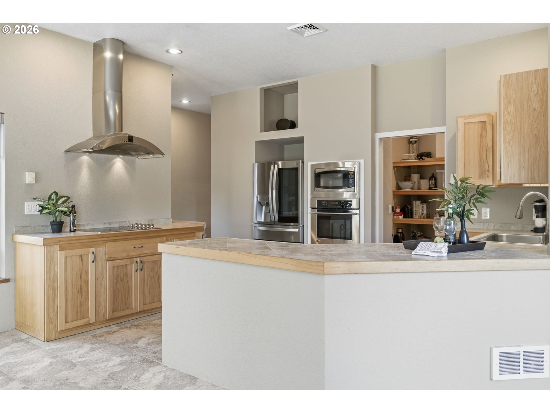 5200 Dunewood Drive Florence, OR 97439 - Photo 10 of 48 a kitchen with stainless steel appliances granite countertop a sink and a refrigerator