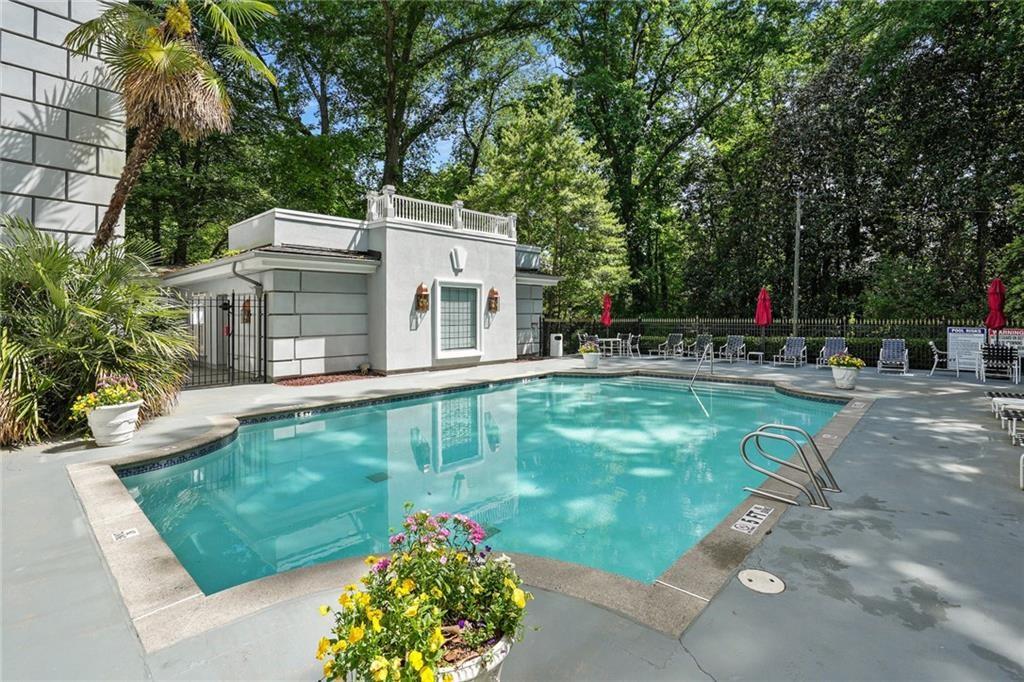 3203 Lenox Road Northeast, Unit 6 Atlanta, GA 30324 - Photo 23 of 27 a view of a house with a backyard porch and sitting area