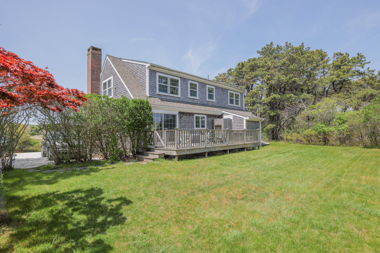 15 Swift Rock Road Nantucket, MA 02554 - Photo 6 of 32 a view of a house with a yard and sitting area
