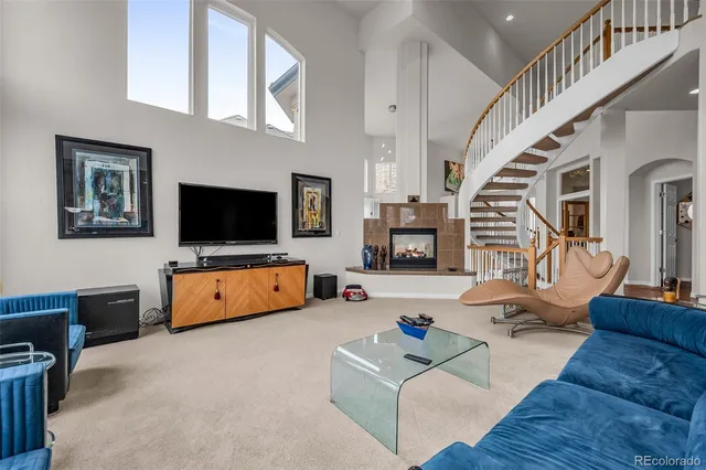 a kitchen with stainless steel appliances kitchen island granite countertop a table chairs and a large window