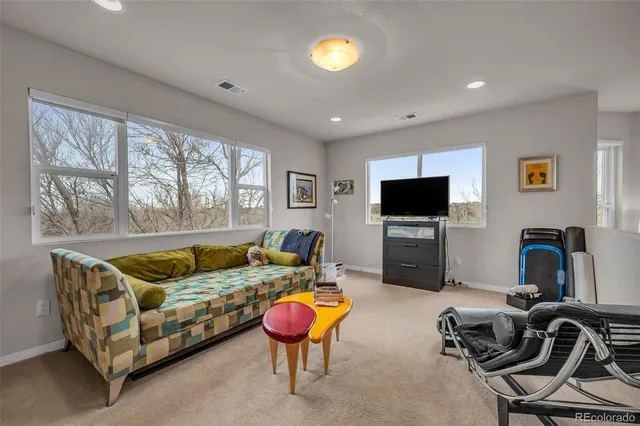 a bathroom with a tub a sink and a window