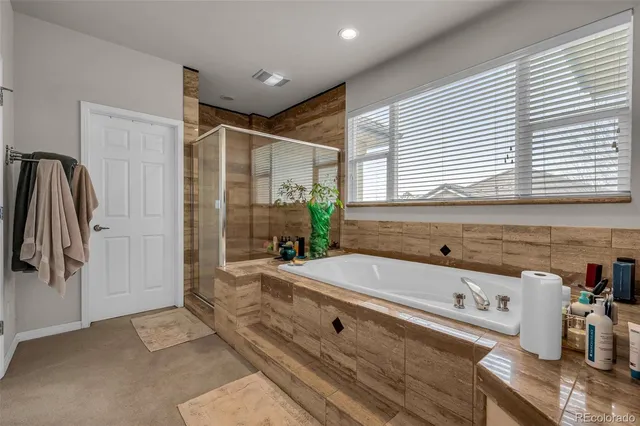 a bedroom with bed and window