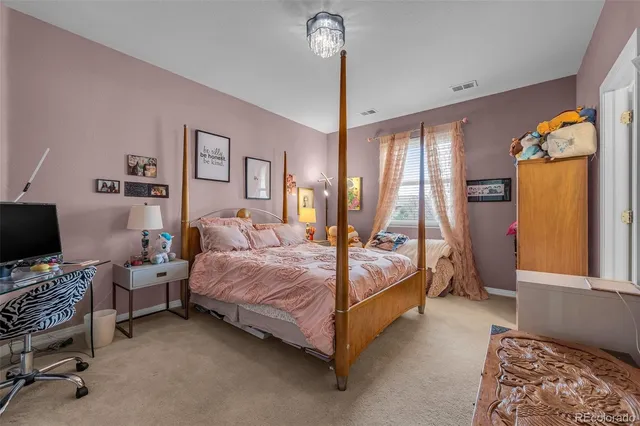 a bathroom with a double vanity sink a mirror and a bathtub