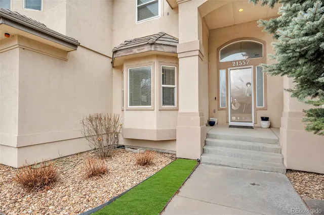 front view of a house with a small yard