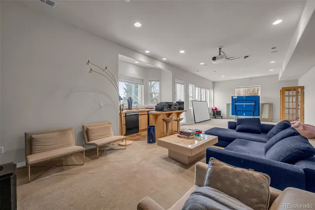 a kitchen with a stove a sink and a refrigerator