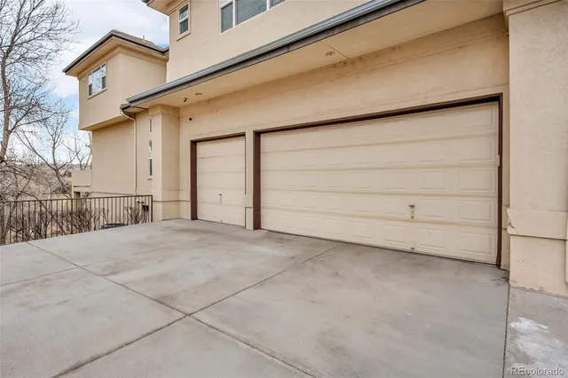 a living room with fireplace furniture and a wooden floor