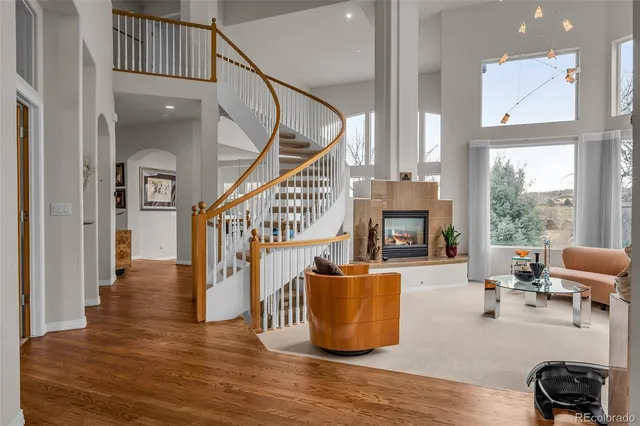 a living room with furniture potted plant and a fireplace