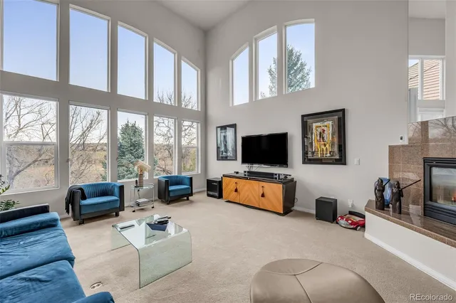 a living room with furniture gym equipment and a flat screen tv