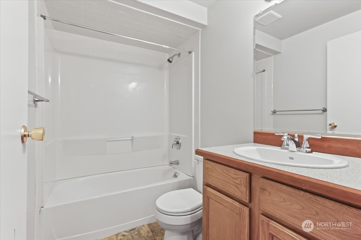 32744 30th Avenue Southwest Federal Way, WA 98023 - Photo 17 of 28 a bathroom with a sink a toilet and shower