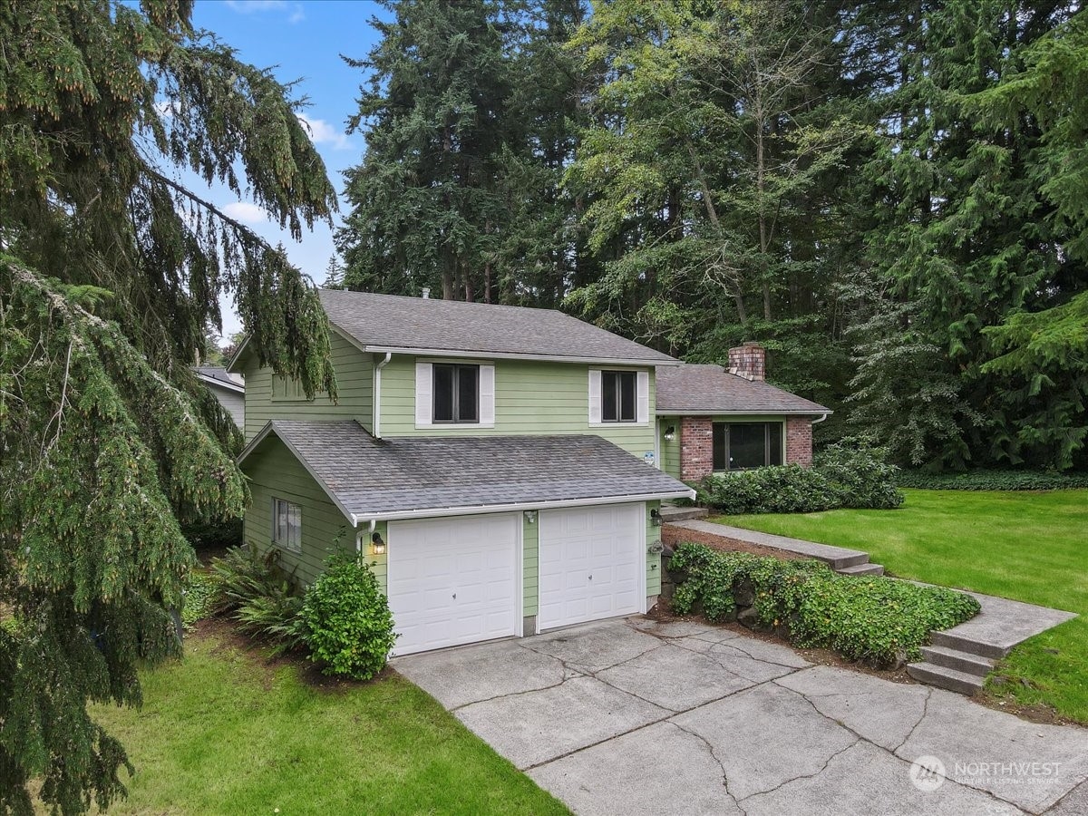 32744 30th Avenue Southwest Federal Way, WA 98023 - Photo 2 of 28 a front view of a house with a yard