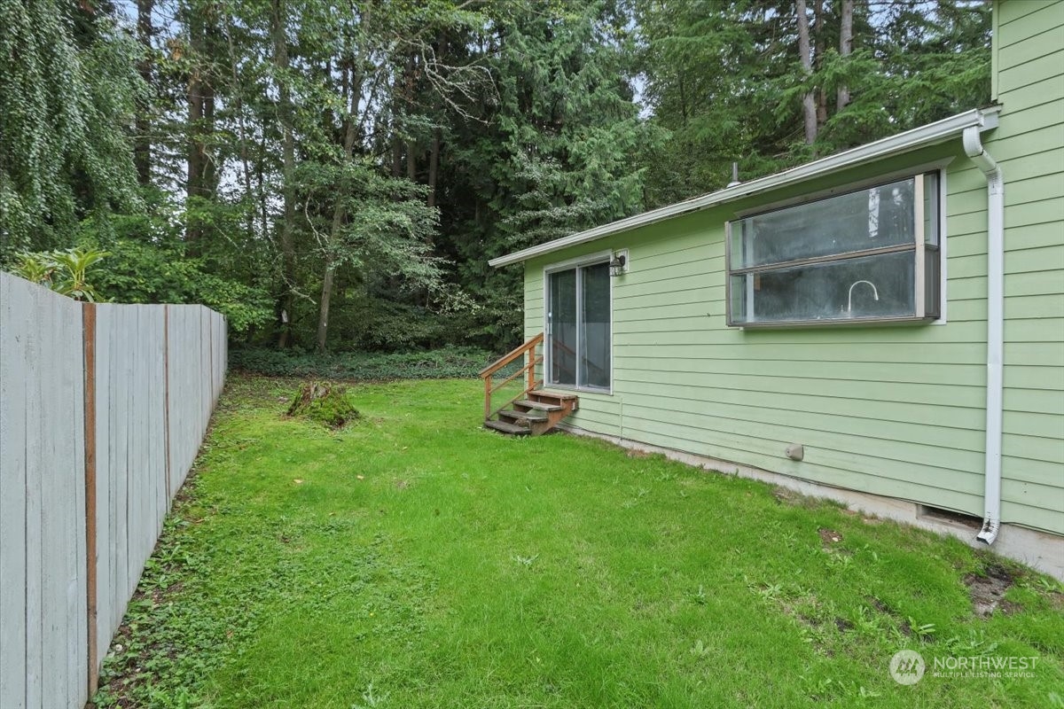 32744 30th Avenue Southwest Federal Way, WA 98023 - Photo 25 of 28 a view of backyard with a small cabin