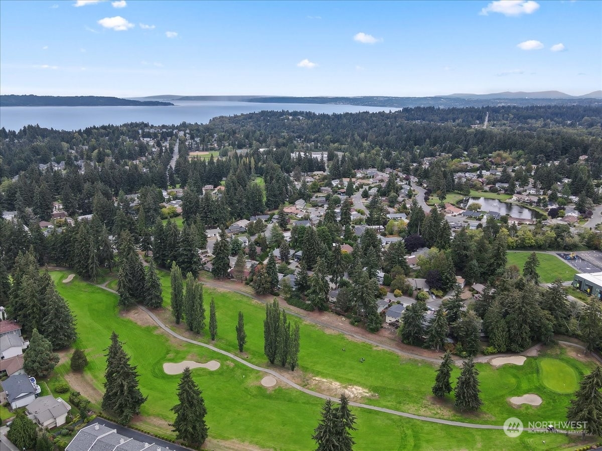 32744 30th Avenue Southwest Federal Way, WA 98023 - Photo 27 of 28 an aerial view of green landscape with trees houses and mountain view