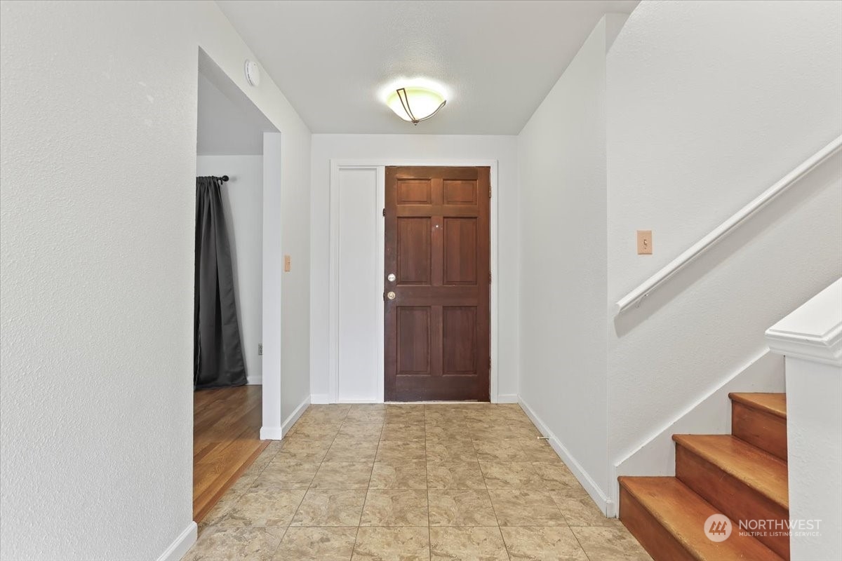 32744 30th Avenue Southwest Federal Way, WA 98023 - Photo 7 of 28 a view of hallway with stairs and wooden floor