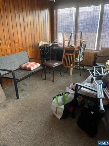 a living room with furniture a window and a table