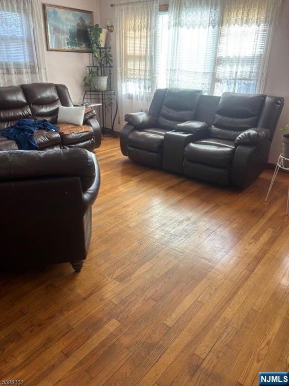 15 Watsessing Avenue, Unit 1 Belleville, NJ 07109 - Photo 3 of 13 a living room with furniture and a large window