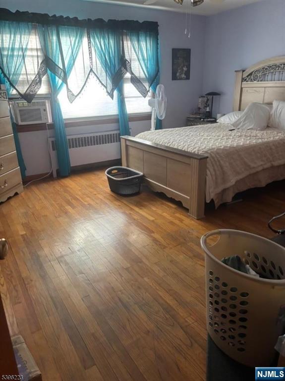 15 Watsessing Avenue, Unit 1 Belleville, NJ 07109 - Photo 4 of 13 a bedroom with a bed and a window