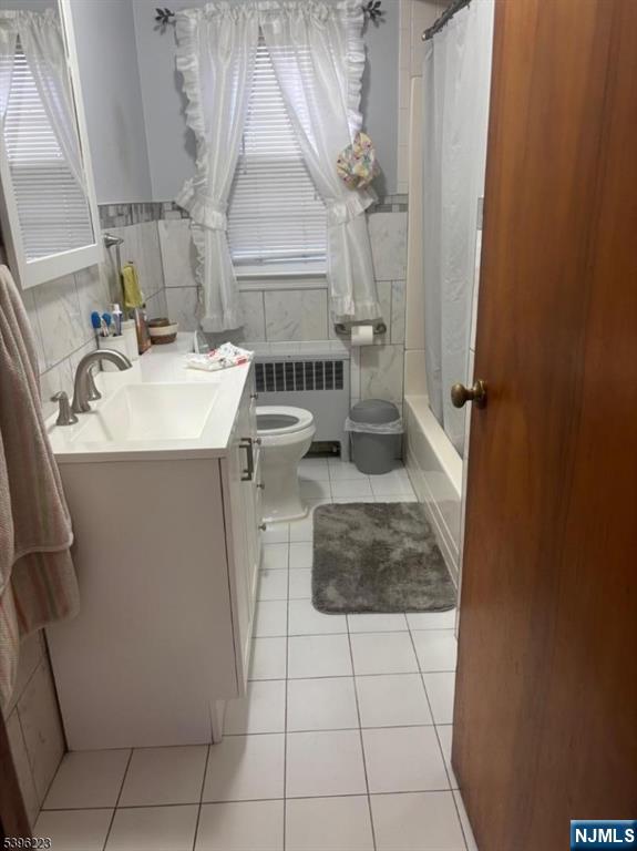 15 Watsessing Avenue, Unit 1 Belleville, NJ 07109 - Photo 7 of 13 a bathroom with a sink toilet and shower