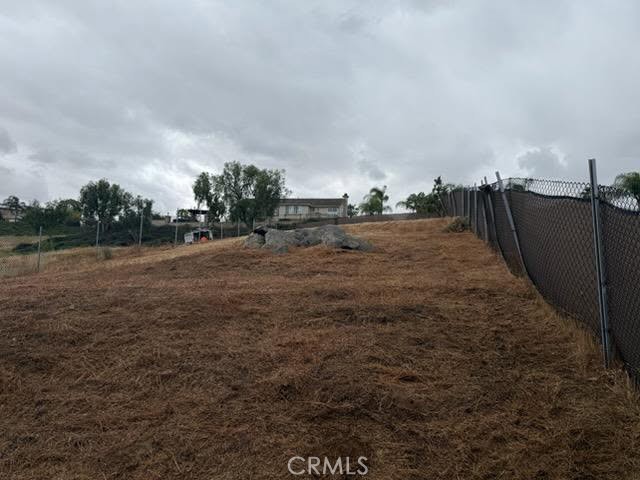 0 Runner Ridge Riverside, CA 92503 - Photo 2 of 3 a view of a dry yard with wooden fence