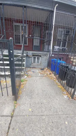 a view of a house with backyard and porch