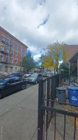 a terrace with outdoor seating and city view