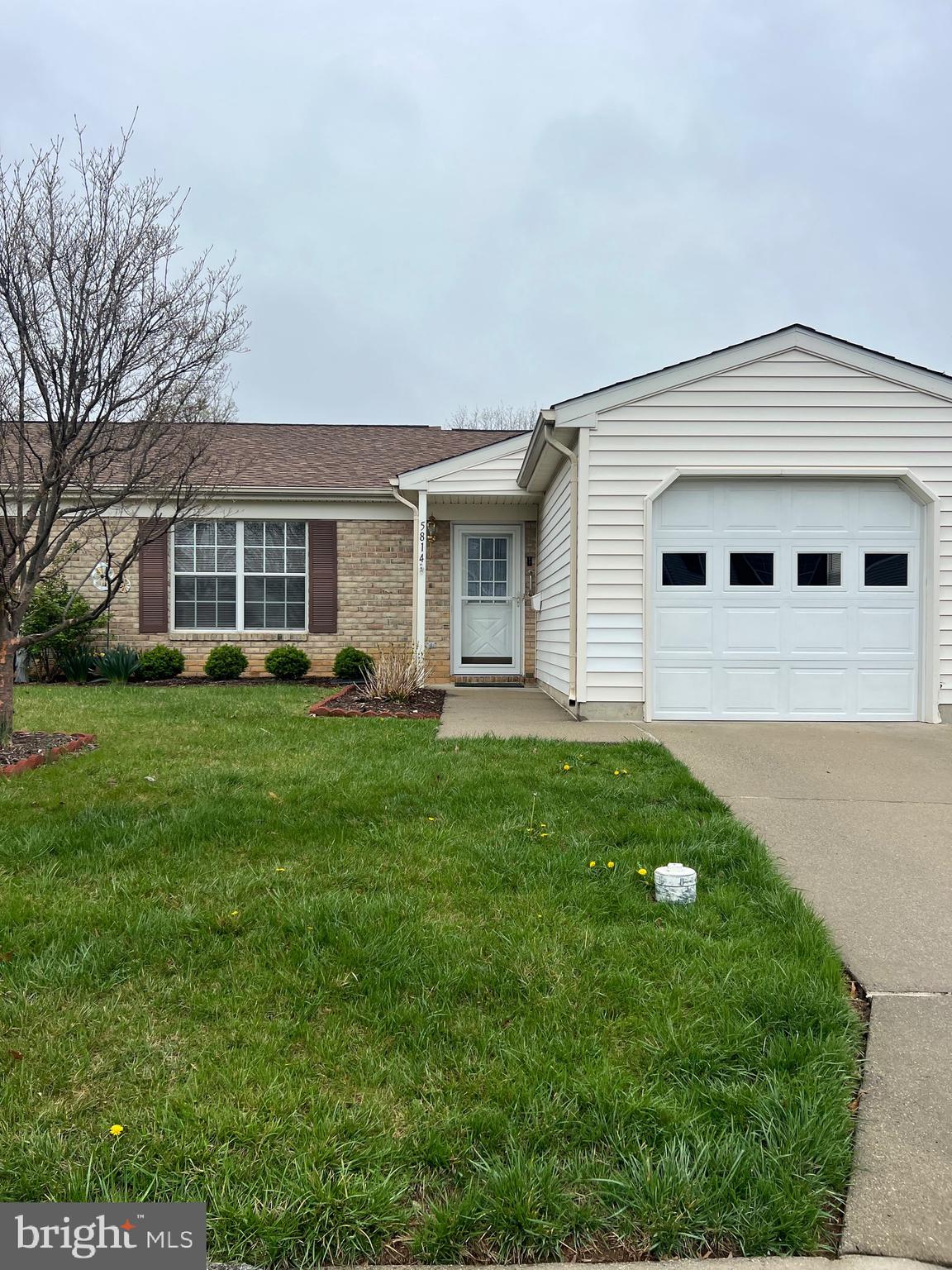 a front view of house with yard