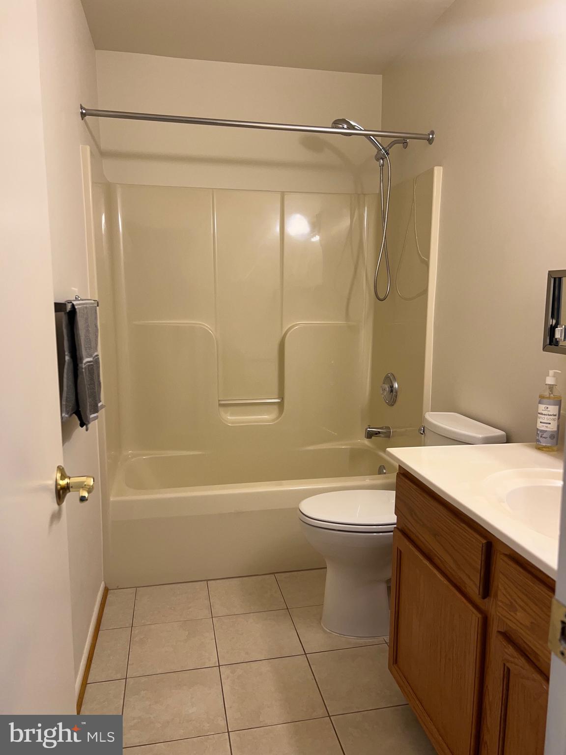 5814 Box Elder Court Frederick, MD 21703 - Photo 11 of 14 a bathroom with a sink a toilet and shower