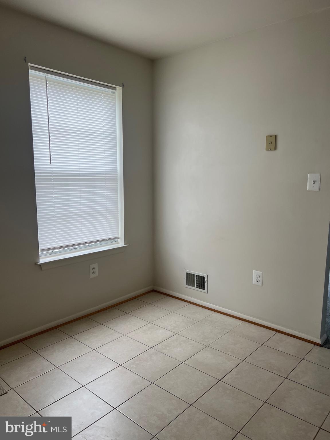 5814 Box Elder Court Frederick, MD 21703 - Photo 5 of 14 an empty room with a window