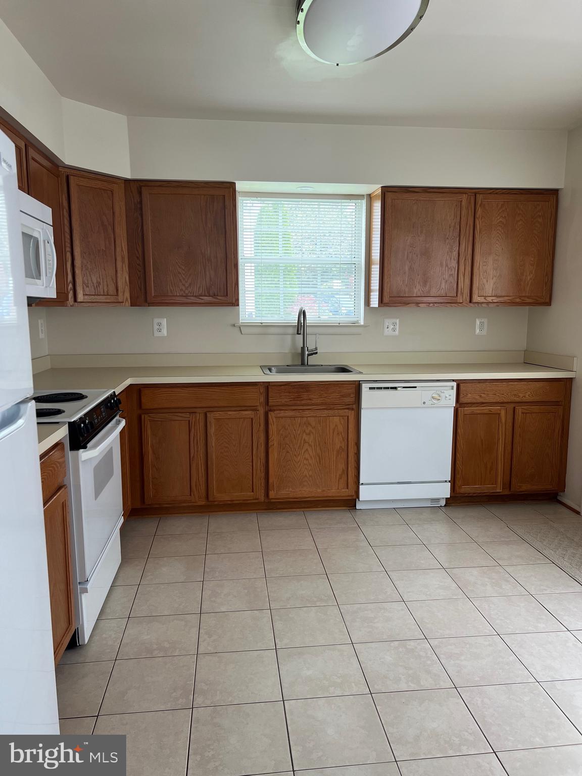 5814 Box Elder Court Frederick, MD 21703 - Photo 6 of 14 a kitchen with stainless steel appliances granite countertop a sink and cabinets