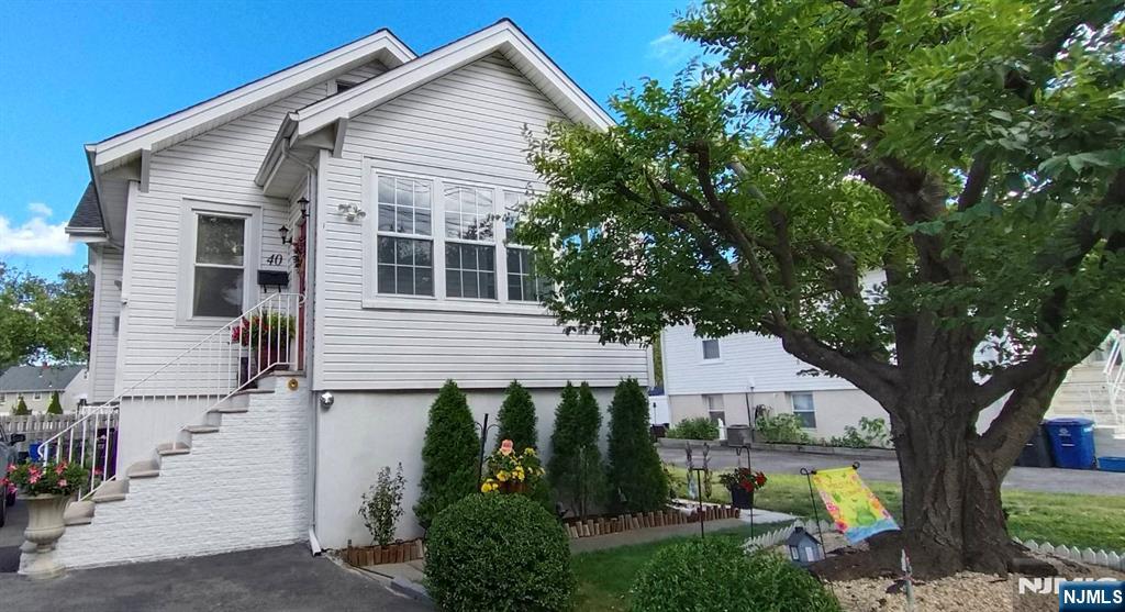 40 Eckel Road Little Ferry, NJ 07643 - Photo 1 of 21 a view of a house with backyard and sitting area