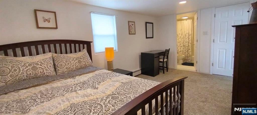 40 Eckel Road Little Ferry, NJ 07643 - Photo 13 of 21 a bedroom with a bed and wooden floor