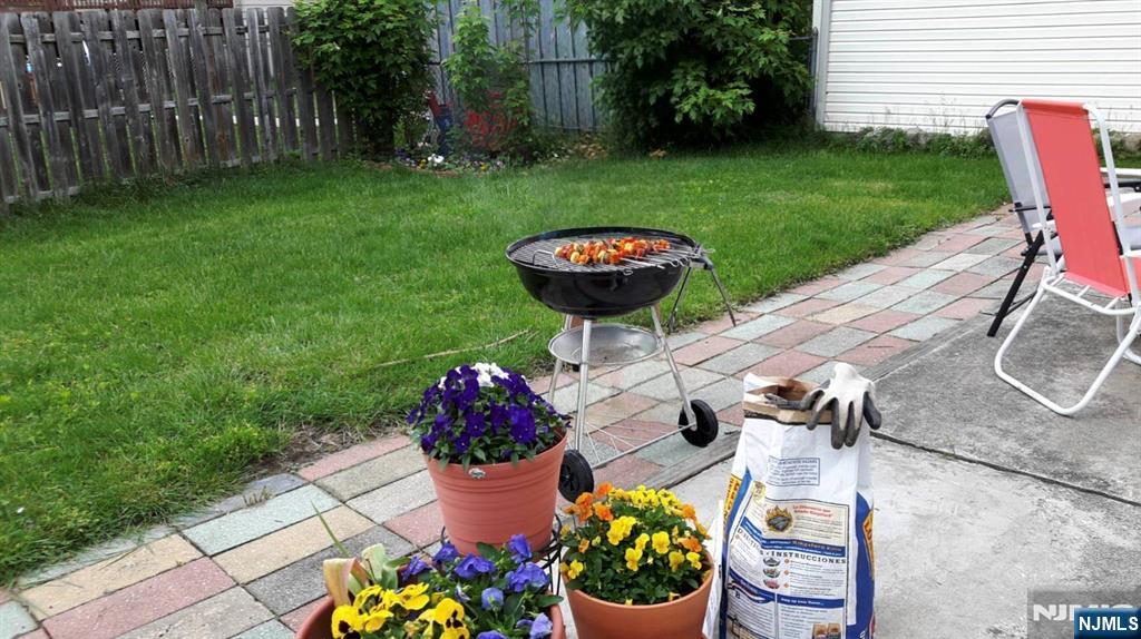 40 Eckel Road Little Ferry, NJ 07643 - Photo 20 of 21 a table and chairs in the garden