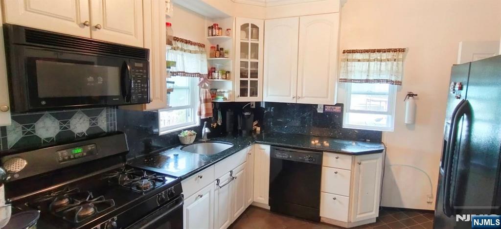 40 Eckel Road Little Ferry, NJ 07643 - Photo 7 of 21 a kitchen with stainless steel appliances granite countertop a sink stove and refrigerator