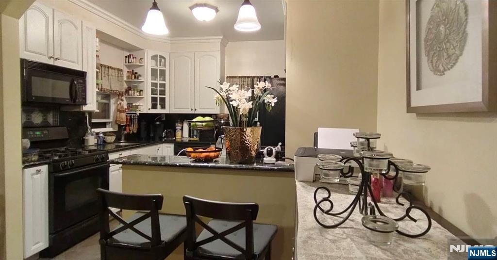 40 Eckel Road Little Ferry, NJ 07643 - Photo 9 of 21 a view of a kitchen with appliances and cabinets