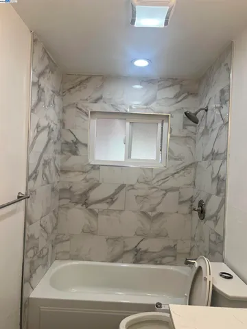 a kitchen with a stove a sink and a refrigerator