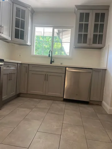 a kitchen with a sink and a window