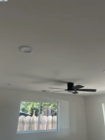 a bathroom with a shower and a toilet