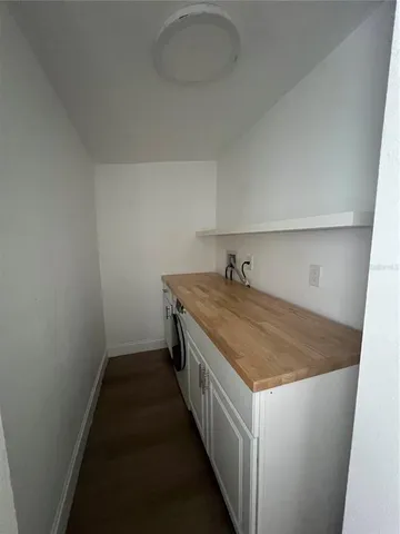 a utility room with a sink dryer and washer