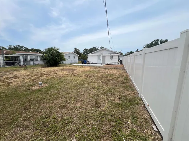 a very nice looking house with a yard