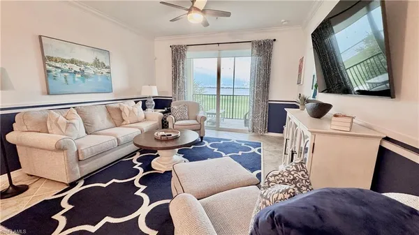 a living room with furniture fireplace and a flat screen tv