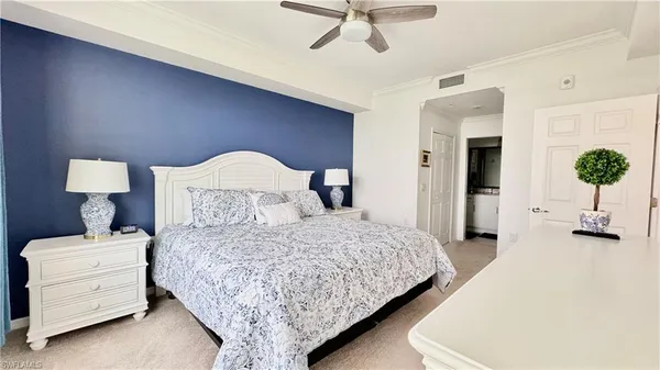 a bedroom with bed and window